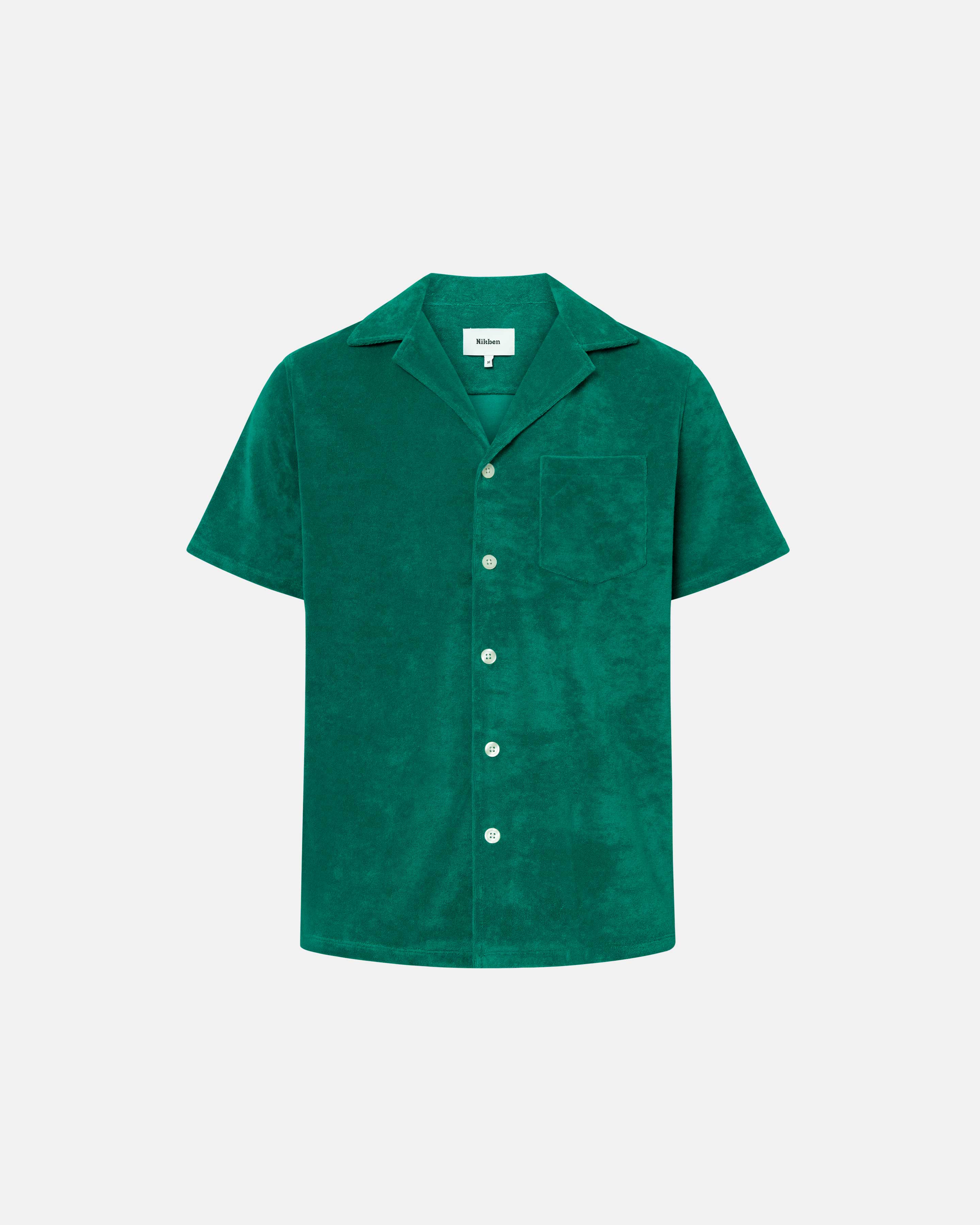 Green short sleeve shirt with white button closure and one chest pocket