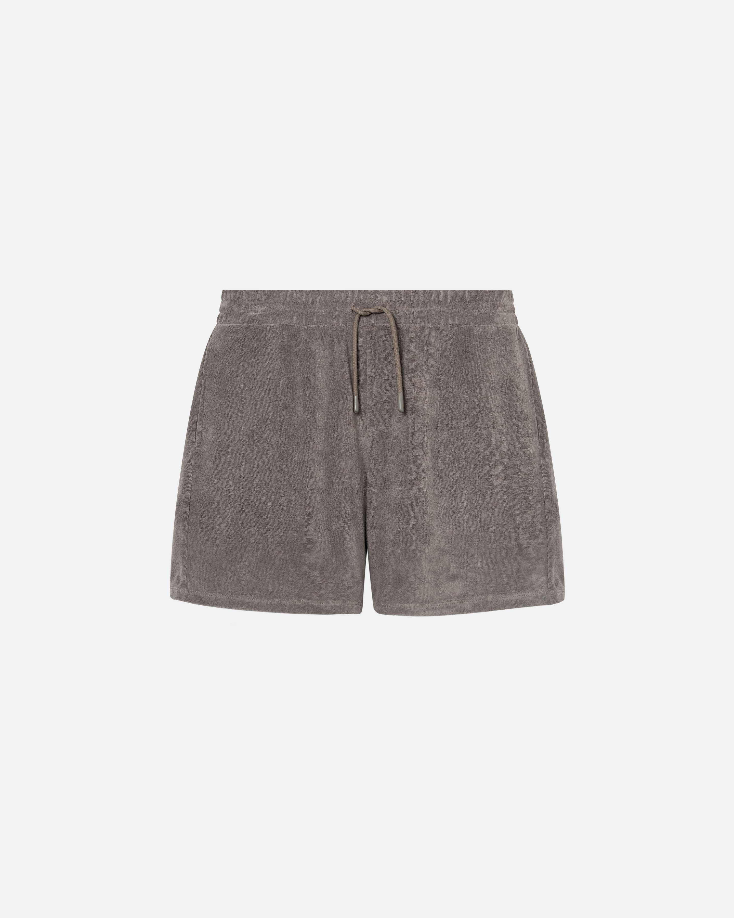 Grey mid length shorts in terry toweling fabric with drawdtring and two side pockets.