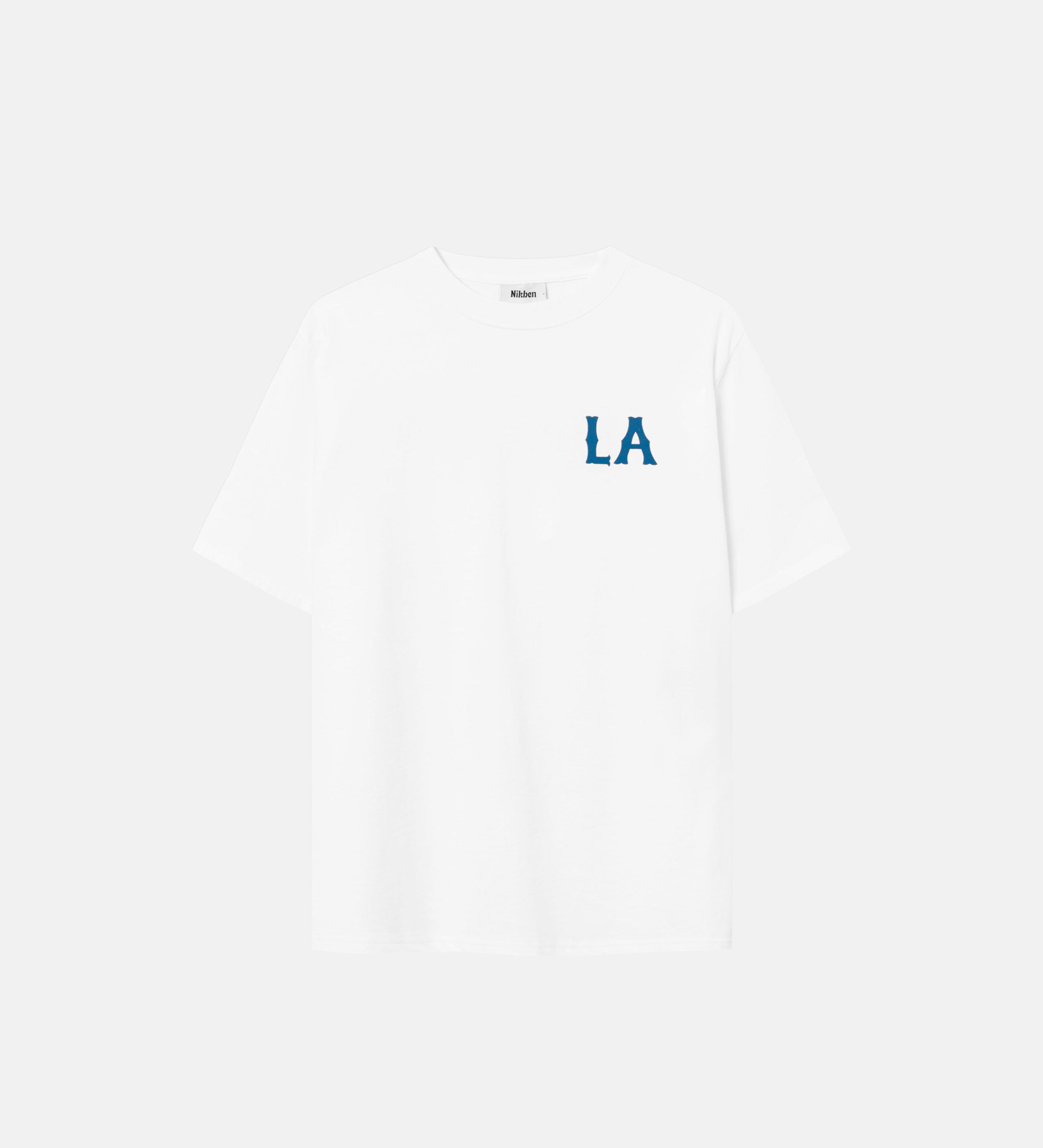 White t-shirt with "LA" chest print in blue letters.