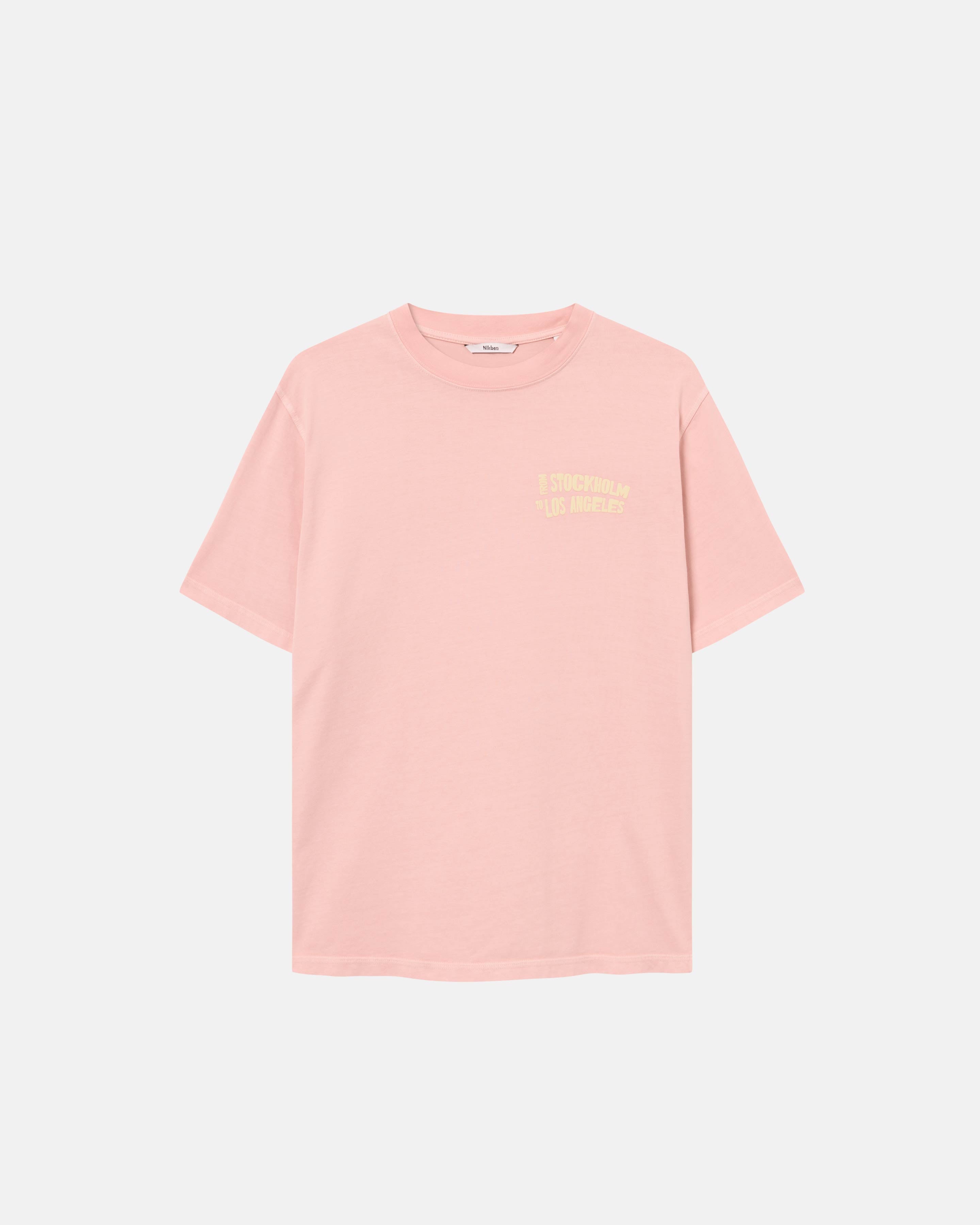 A salmon colored t-shirt with a yellow text print on its chest
