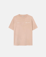 A sand colored t-shirt with "jamaica" text print on a sand colored t-shirt