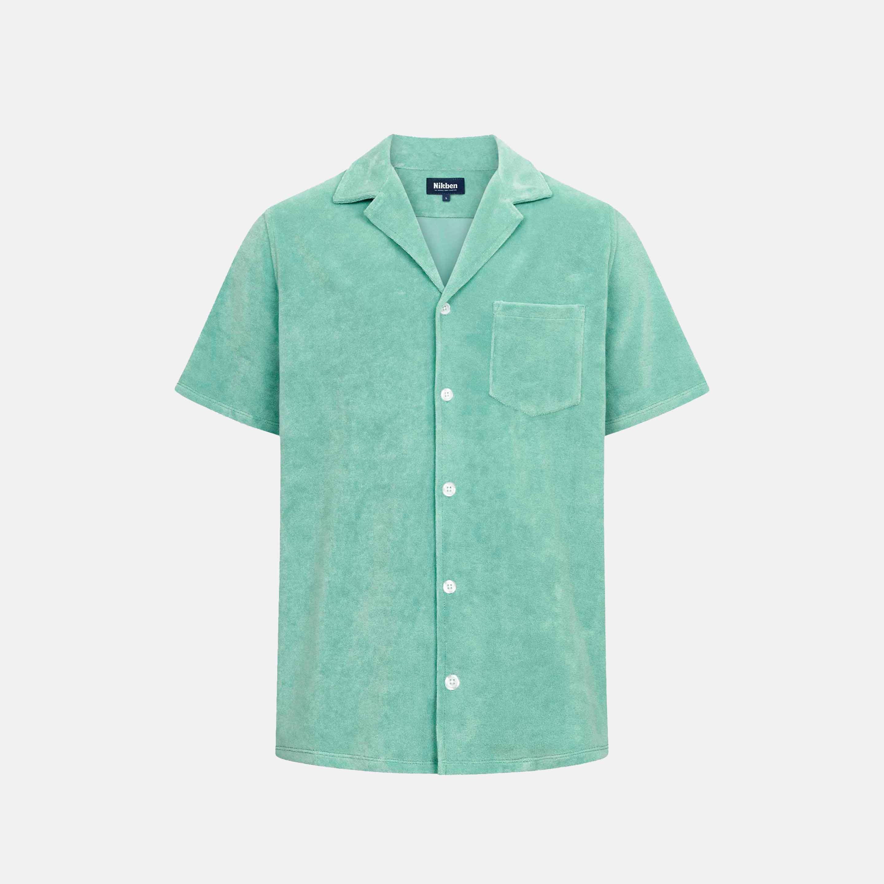 Grey-Green short sleeve shirt with white button closure and one chest pocket