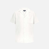 Off white short sleeve shirt with white button closure and one chest pocket