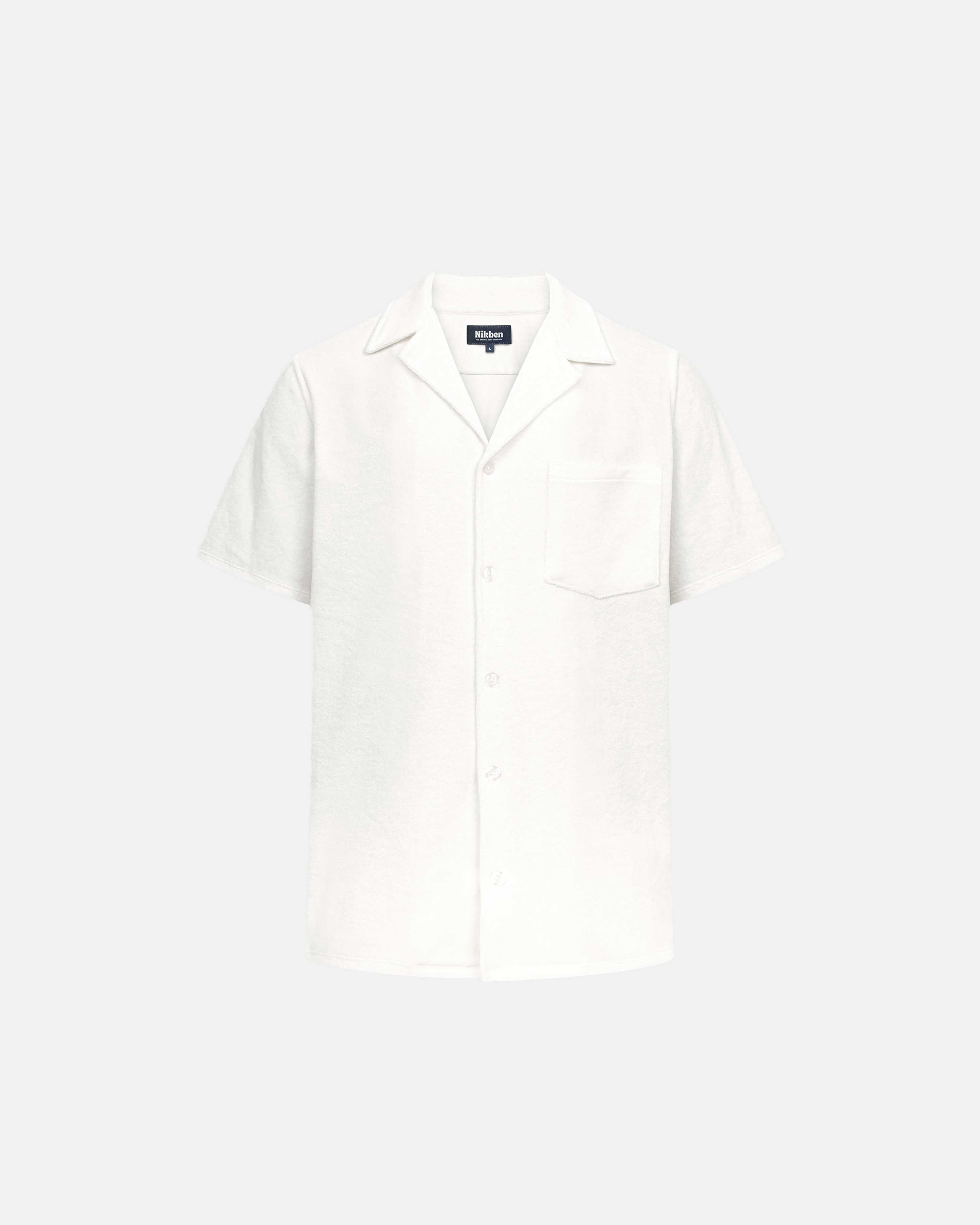 Off white short sleeve shirt with white button closure and one chest pocket