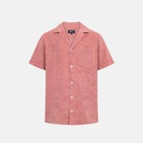 Red/brown short sleeve shirt with white button closure and one chest pocket