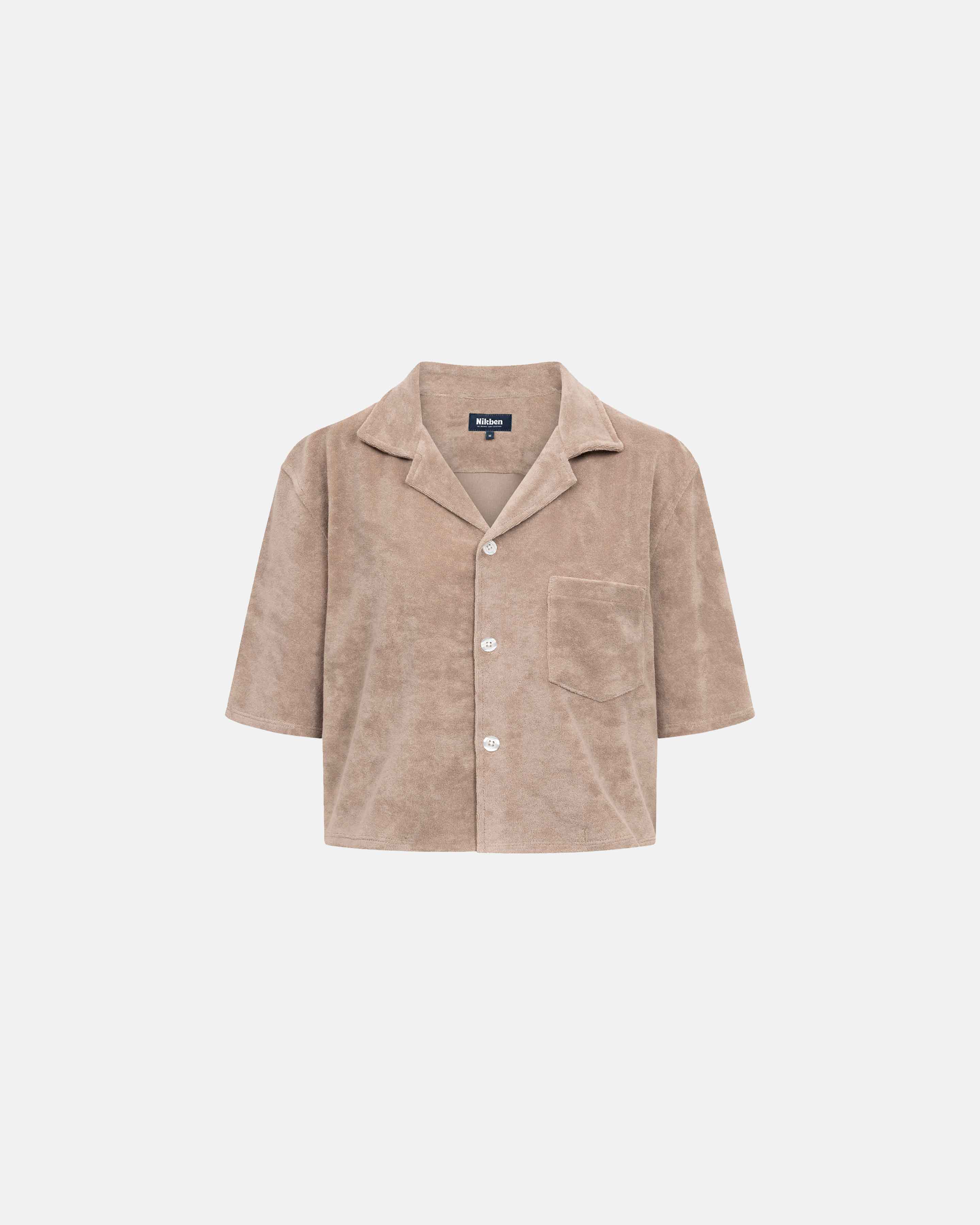 Light brown, short sleeve, cropped shirt with white button closure and one chest pocket