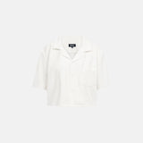 White, short sleeve, cropped shirt with white button closure and one chest pocket