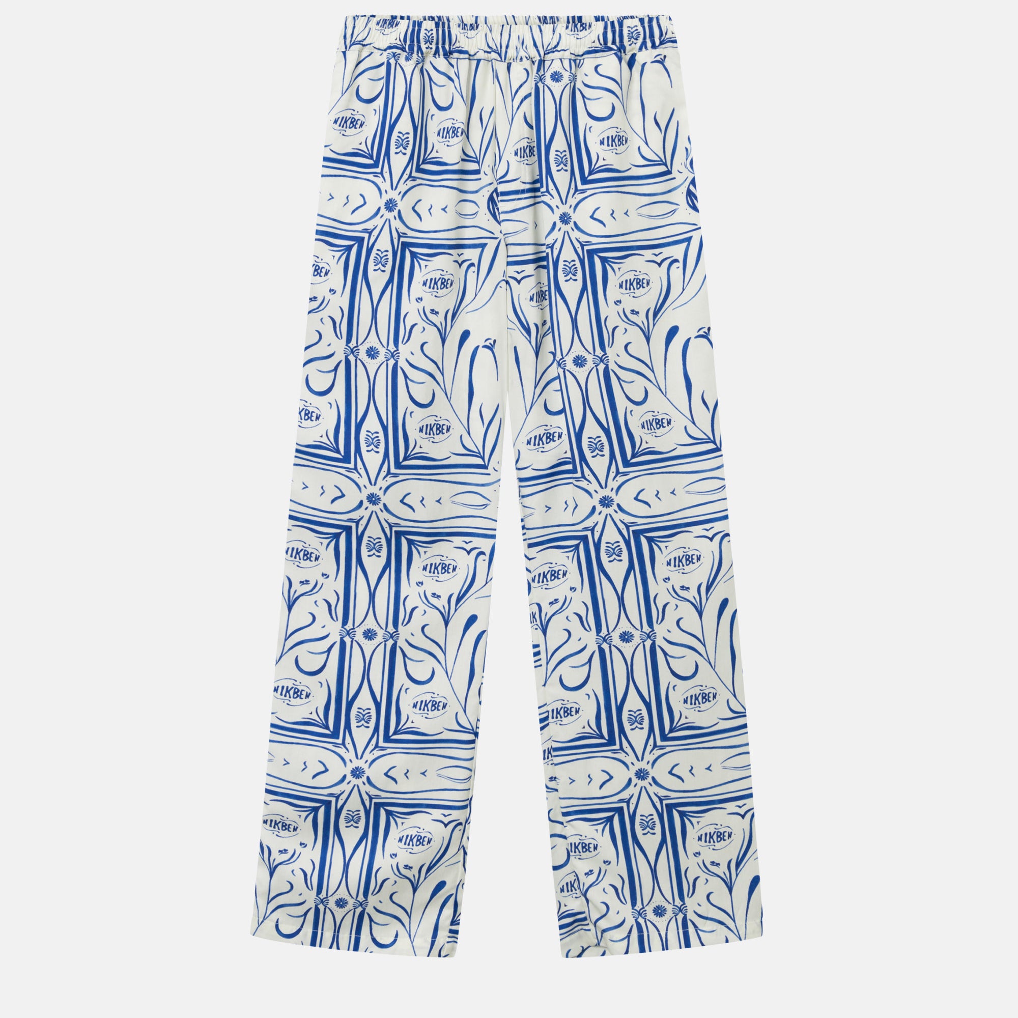 White vacation pants with a blue graphic pattern, two front pockets, and an elastic drawstring.