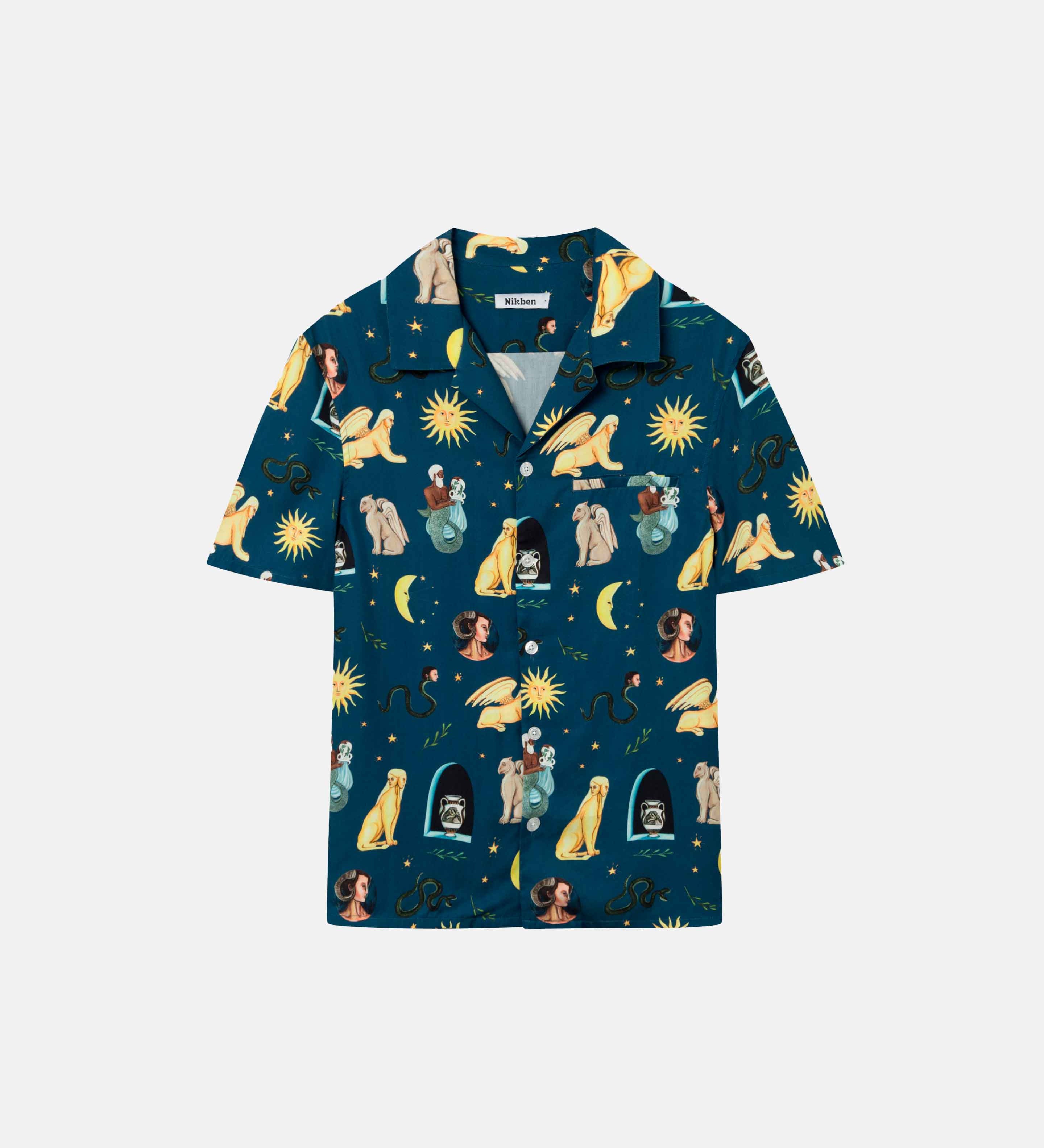 Navy short-sleeved vacation shirt with a multi-colored graphic pattern, open collar, one breast pocket, and button closure.