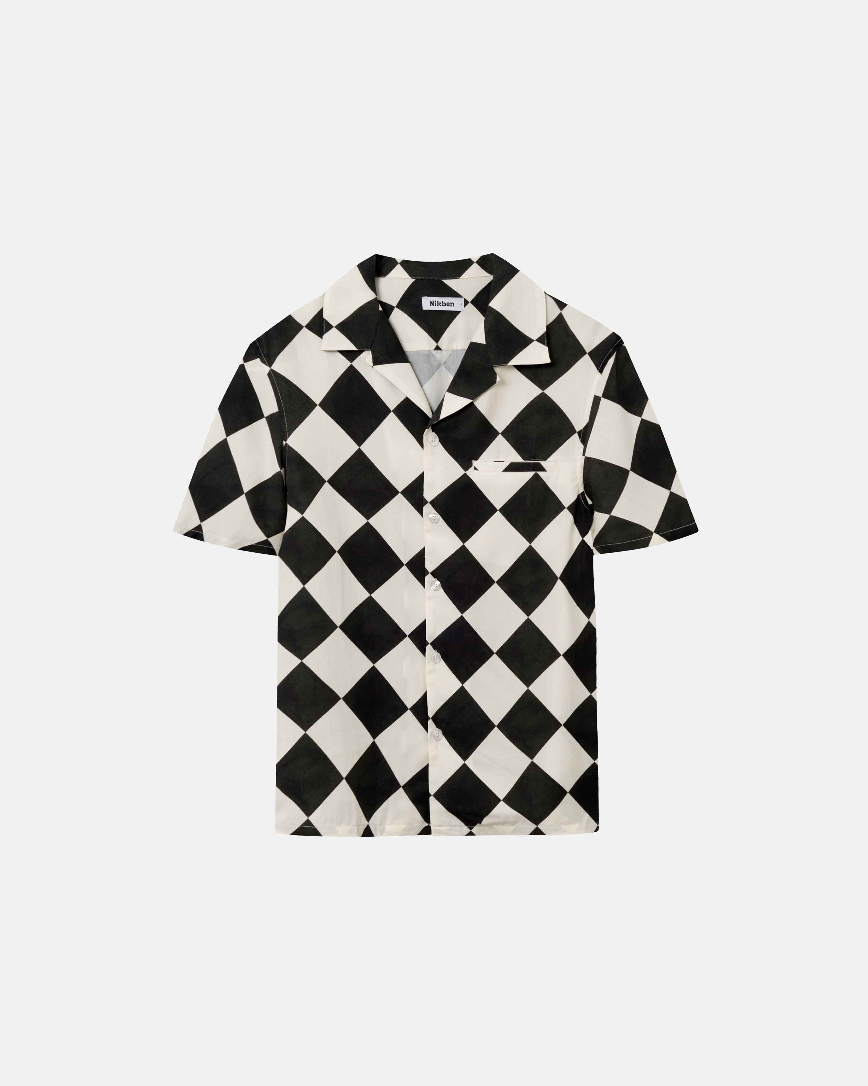Short-sleeved vacation shirt with a black and white checkered pattern, open collar, one breast pocket, and button closure.