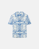 White short-sleeved vacation shirt with blue graphic pattern, open collar, one breast pocket, and button closure.