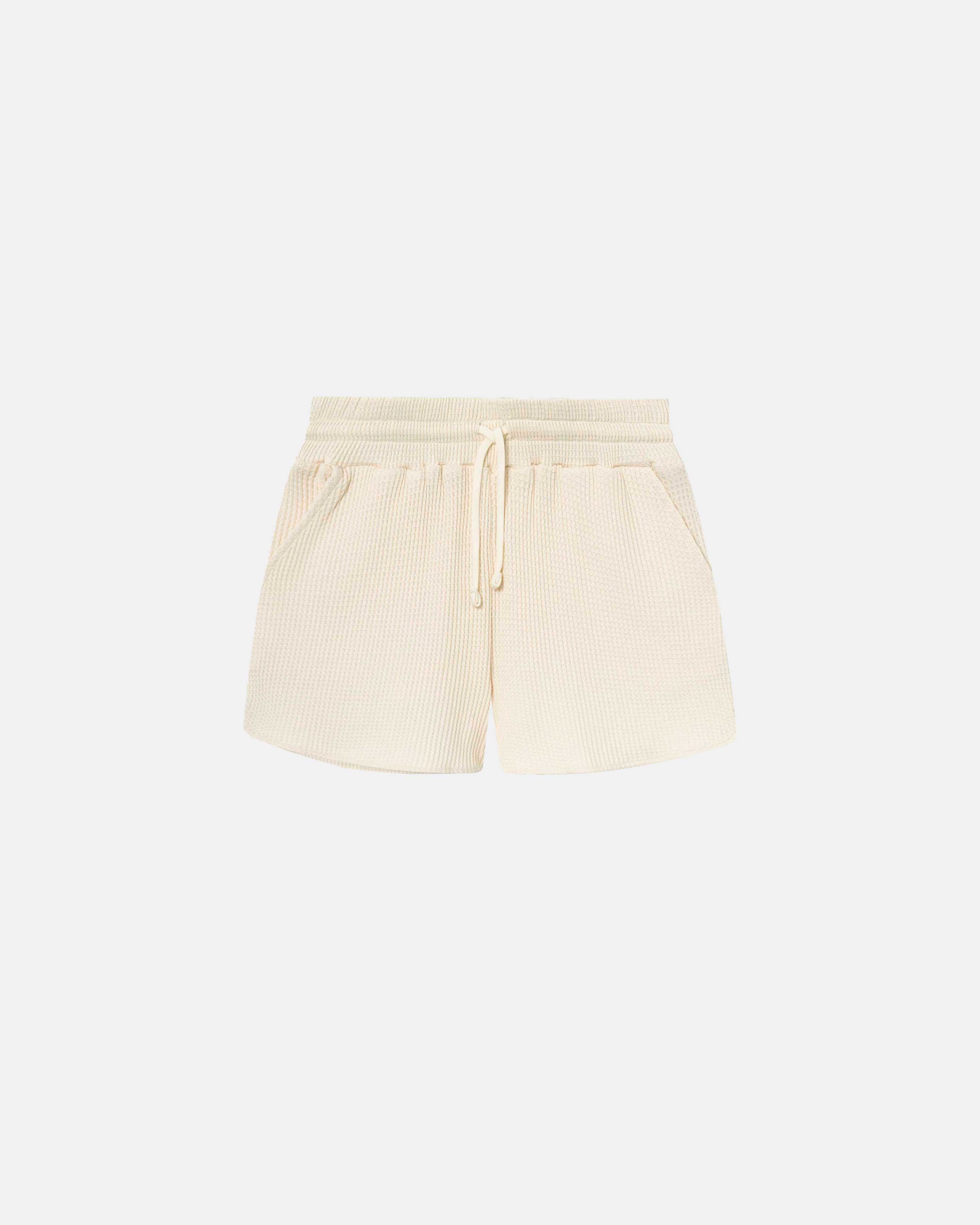 Off white waffle-patterned short-length shorts with two front pockets and a drawstring.