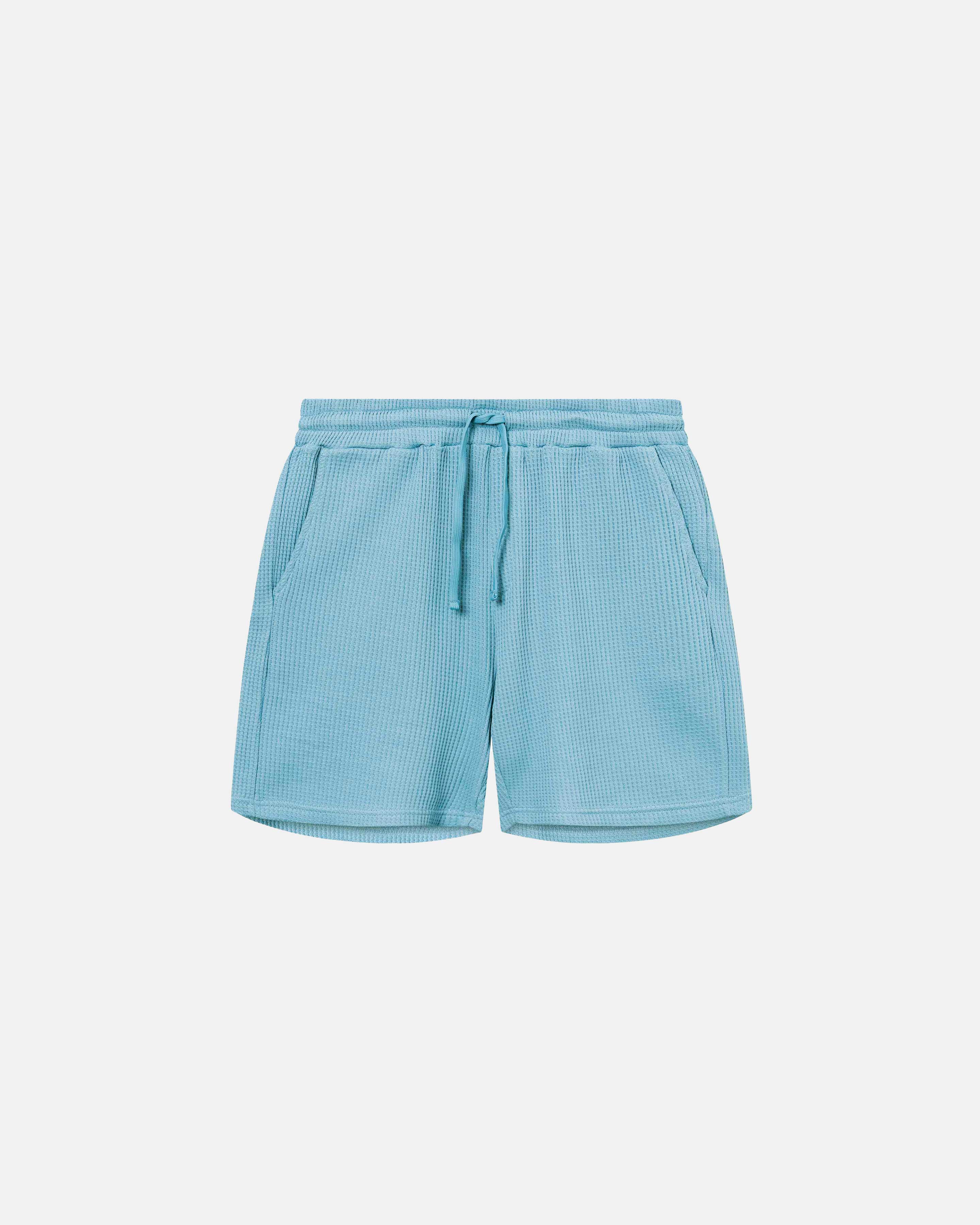 Sky blue waffle-patterned mid-length shorts with two front pockets and a drawstring.