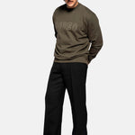 Male model wearing a Tarmac colored sweatshirt with "Rodeo" stitching