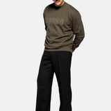 Male model wearing a Tarmac colored sweatshirt with "Rodeo" stitching