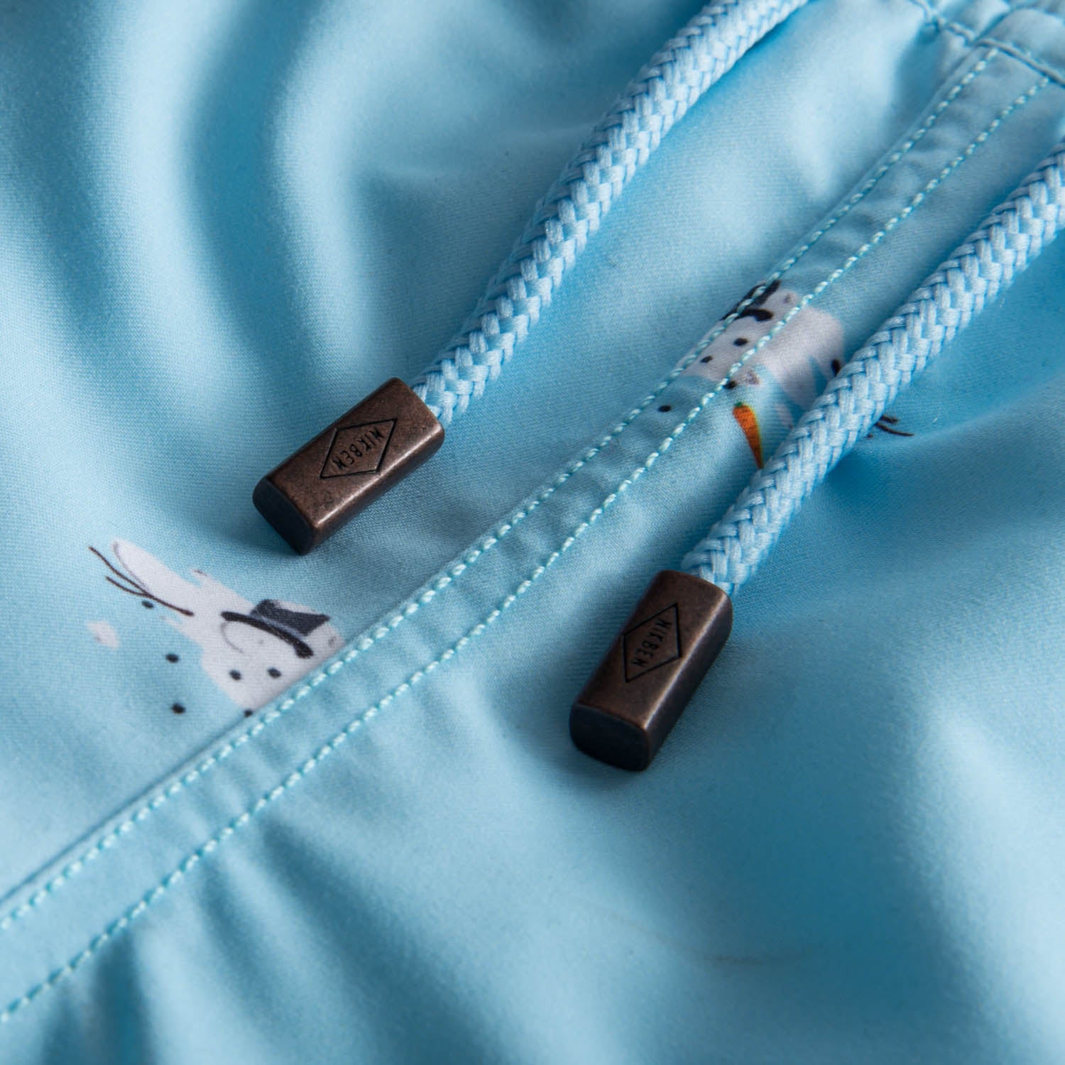Drawstring waistband on blue printed kids swim trunks