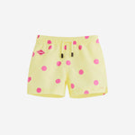 Yellow kids swim trunks with pink dots