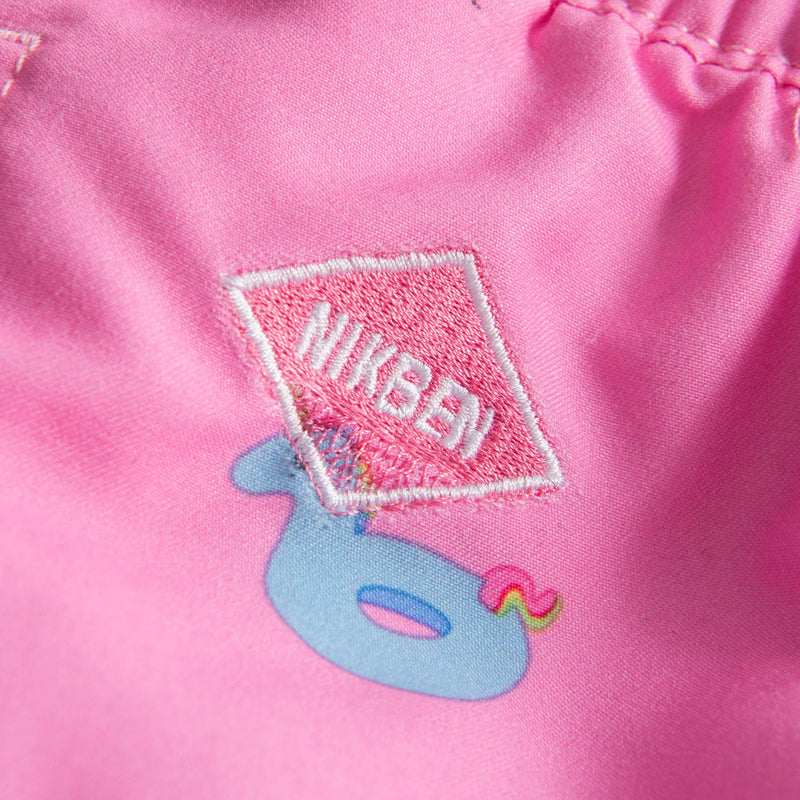 Logo on pink printed kids swim trunks
