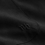 Close up of embroidery on black shirt