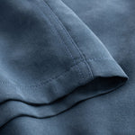 Close up of sleeve on blue shirt