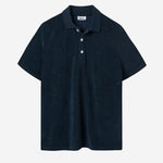 Dark blue short sleeve piké shirt in terry toweling fabric.