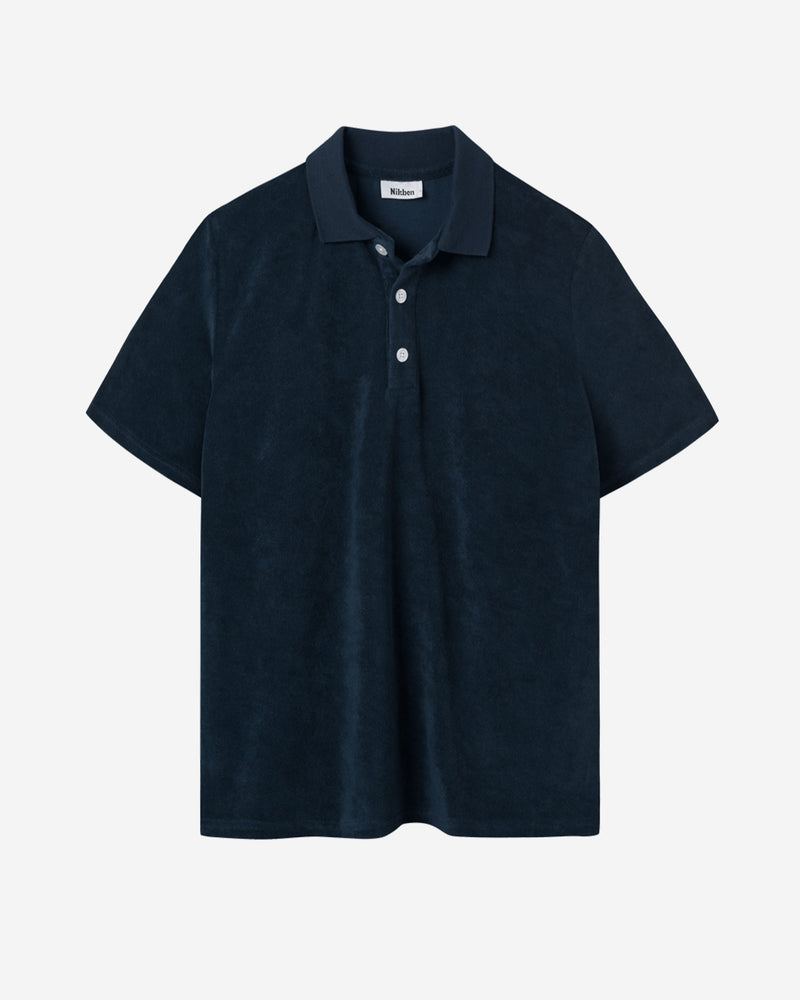 Dark blue short sleeve piké shirt in terry toweling fabric.