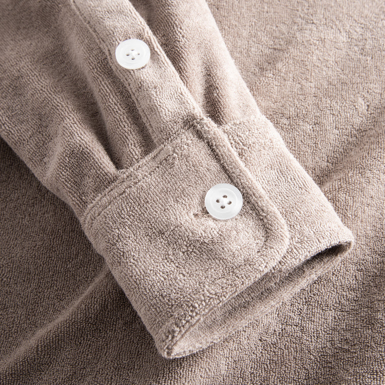 Sleeve with white buttons on shirt in Terry toweling fabric