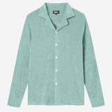 Green long sleeve shirt with white buttons