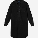 Black kaftan in terry toweling fabric. With half button closure and one chest pocket