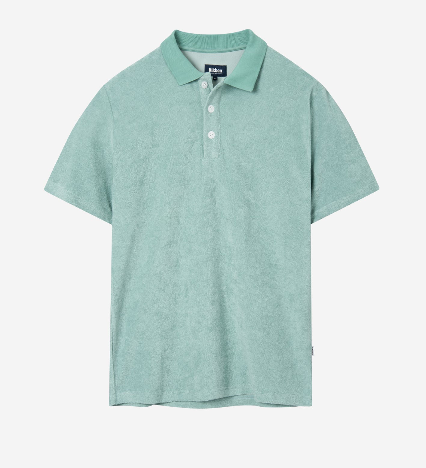 Grey-green short sleeve piké shirt in terry toweling fabric.
