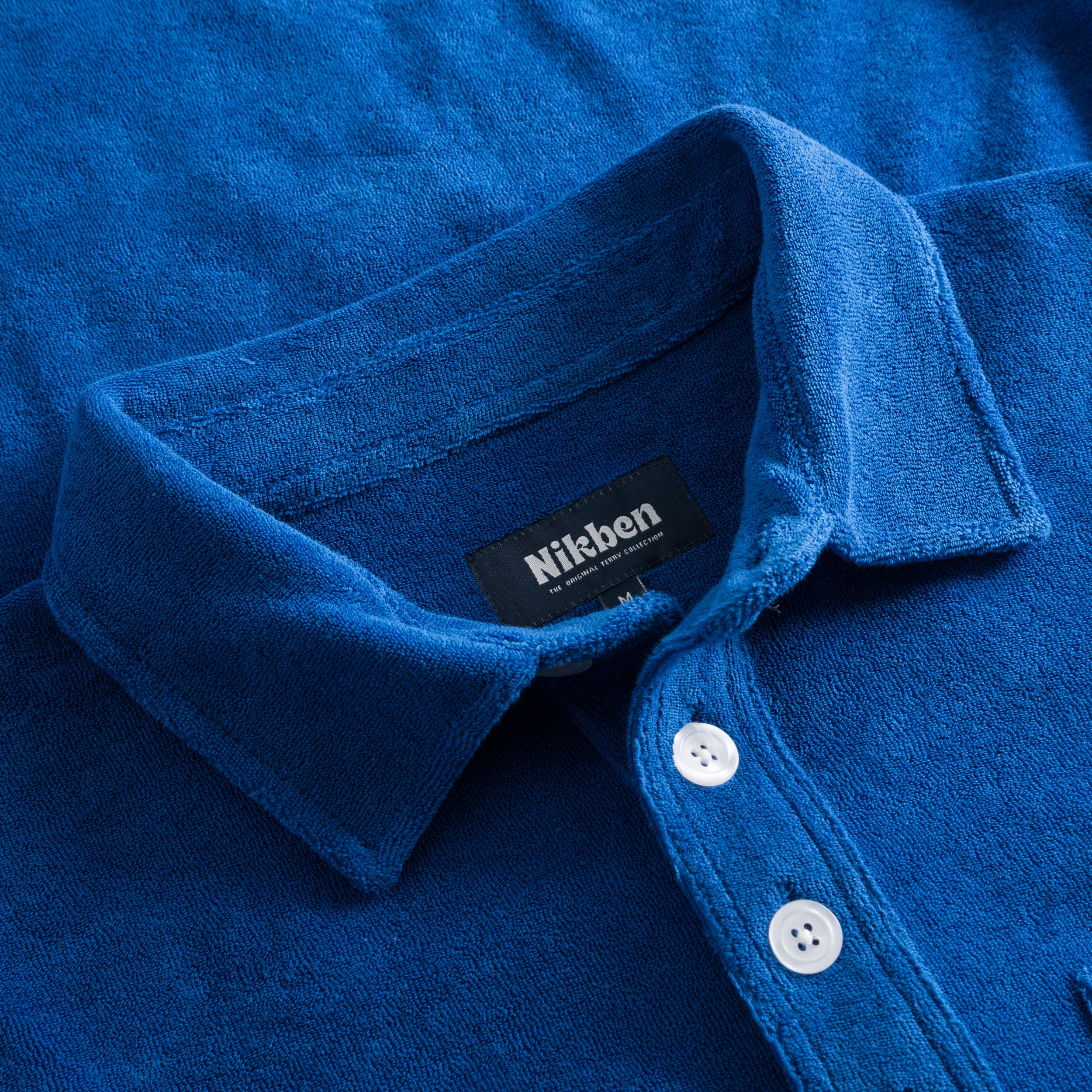 Collar on indigo blue shirt in terry towelling fabric