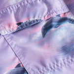 Back pocket on purple swim trunks