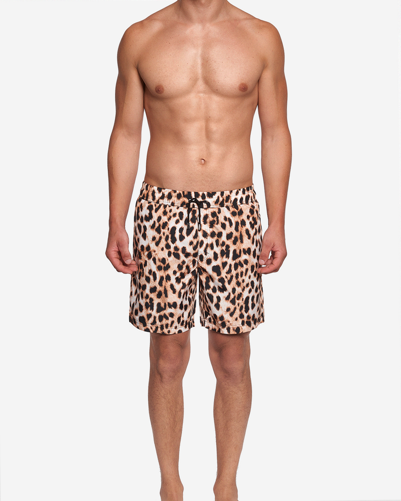 Model wearing leopard printed extended-length swim trunks