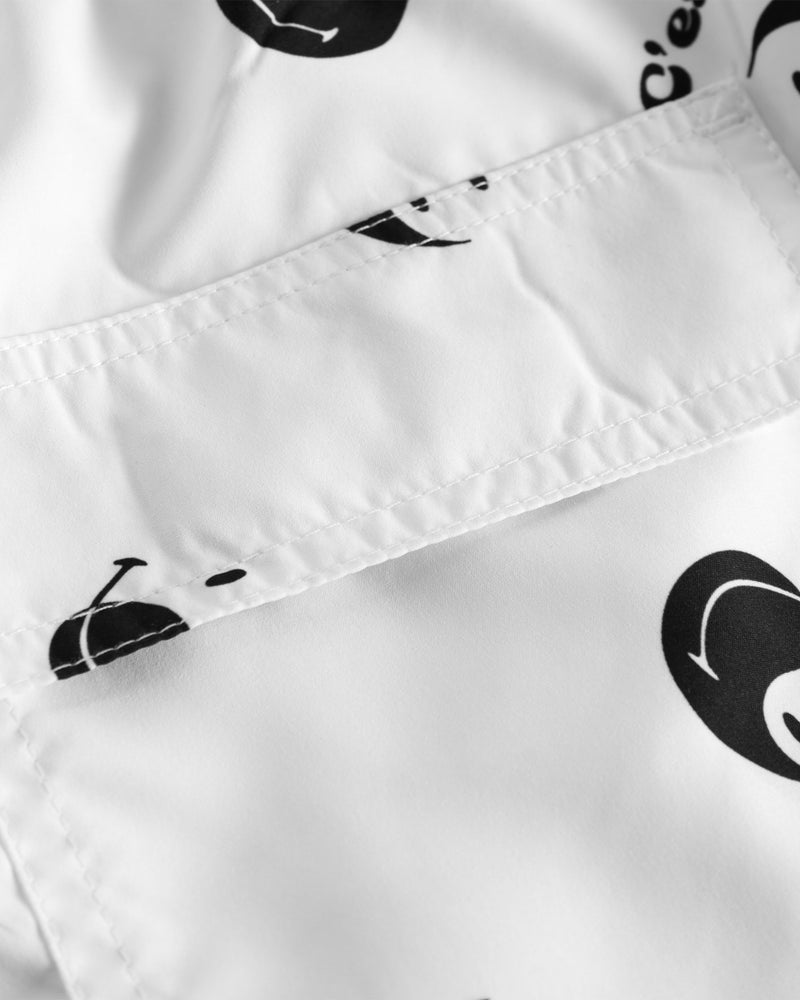 Back pocket on white swim trunks with black smiley print