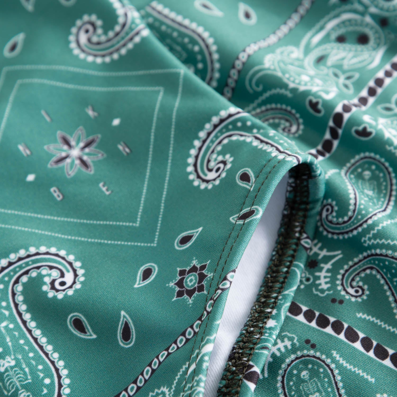 Close up on green patterned swimsuit
