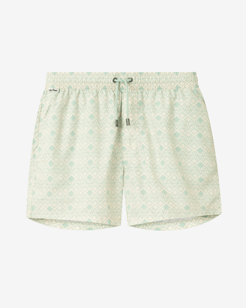 Light green patterned swim trunks. Mid length shorts with drawstring waistband and two side pockets.