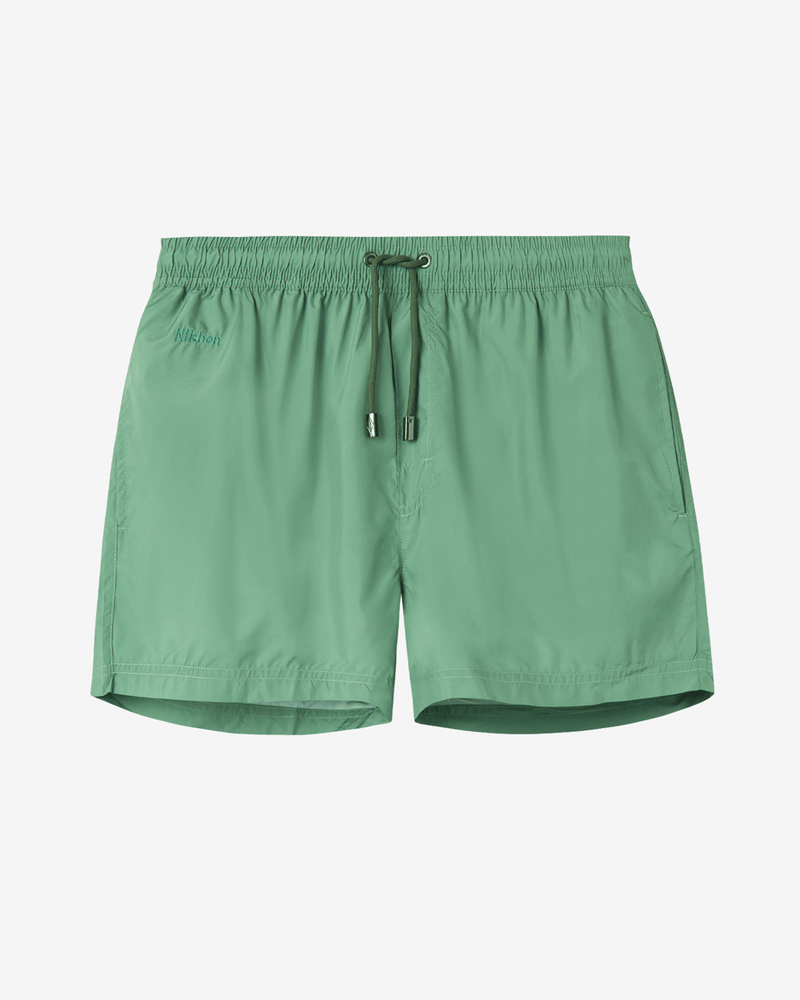 Green swim trunks. Mid length with drawstring and two side pockets.