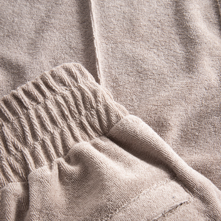 Close up of cashmere colored pants in Terry toweling fabric