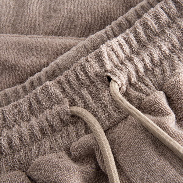 Close up of waistband and drawstring on cashmere colored shorts in Terry toweling fabric