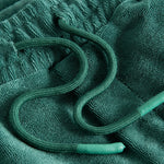 Green drawstring on green shorts in Terry toweling fabric