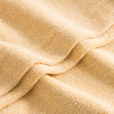 Close up of sand colored terry towelling fabric