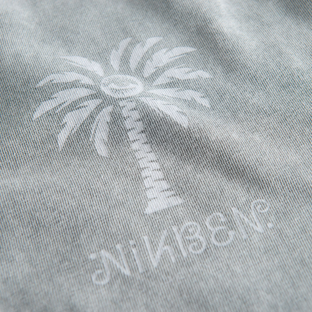Close up of white palm print on a grey t-shirt.