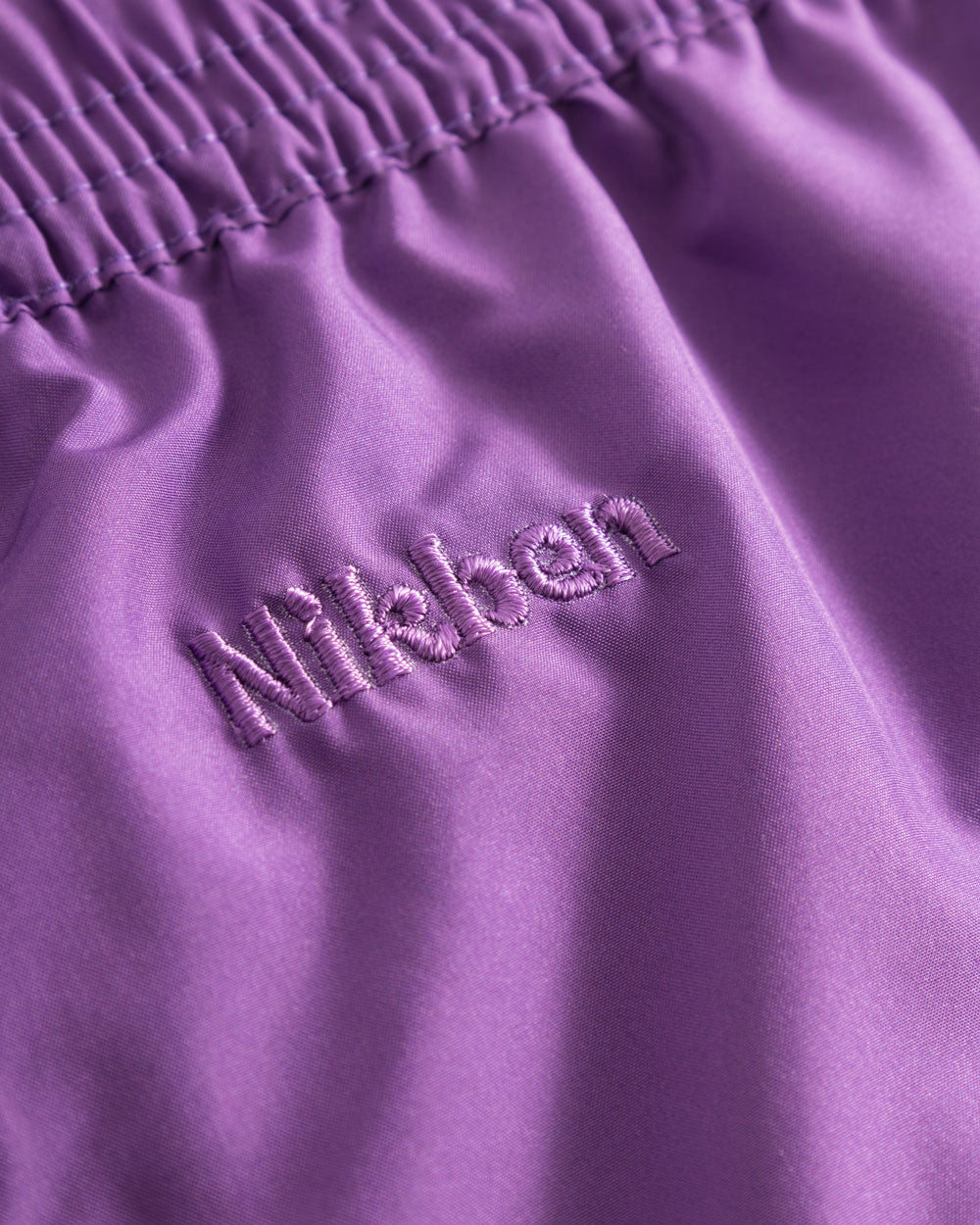 Purple logo embroidery