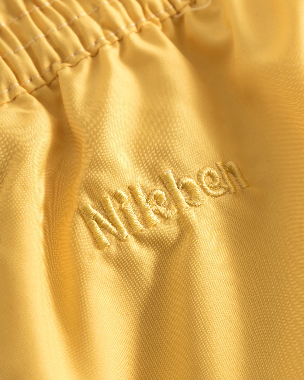 Yellow logo embroidery