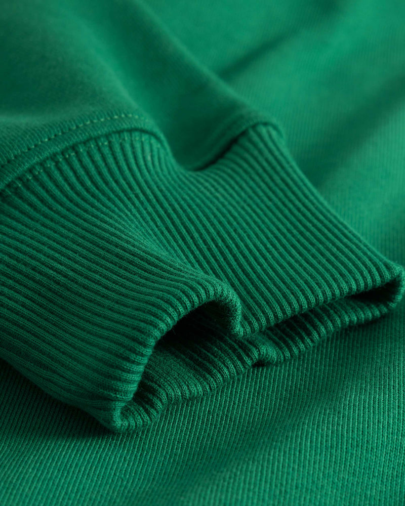 Sleeve on green hoodie