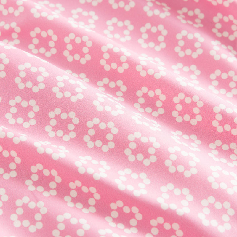 Close up on pink and white patterned fabric