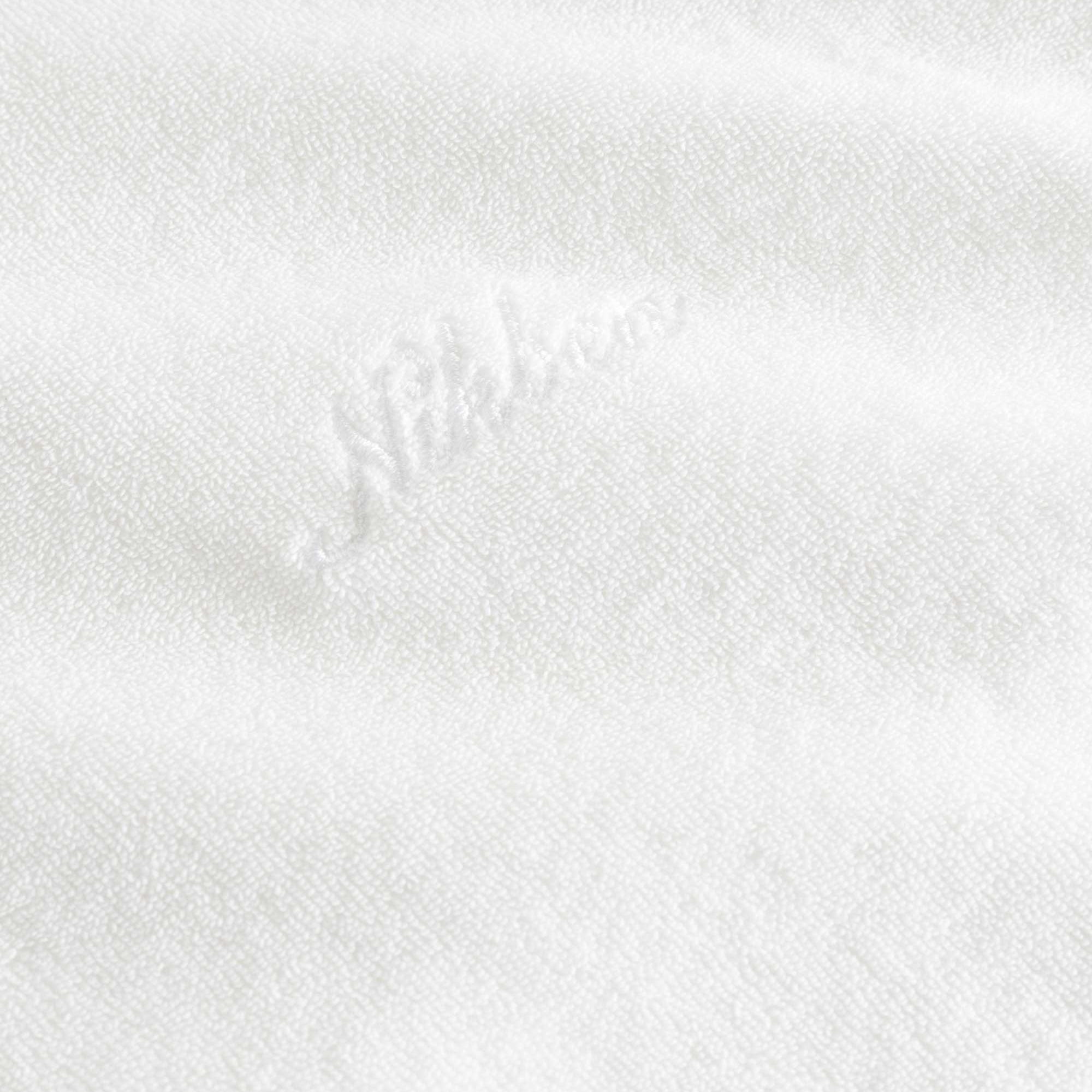 White "nikben" logo on a white hoodie