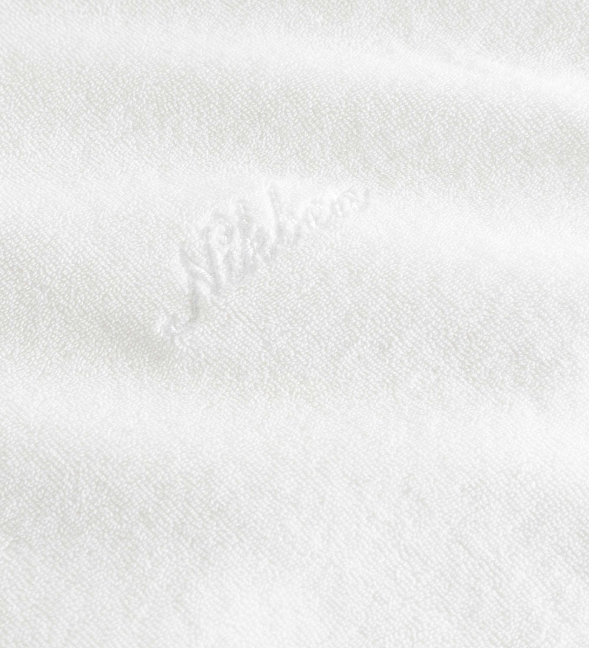 White "nikben" logo on a white hoodie