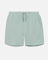 Mint green waffle-patterned mid-length shorts with two front pockets and a drawstring.