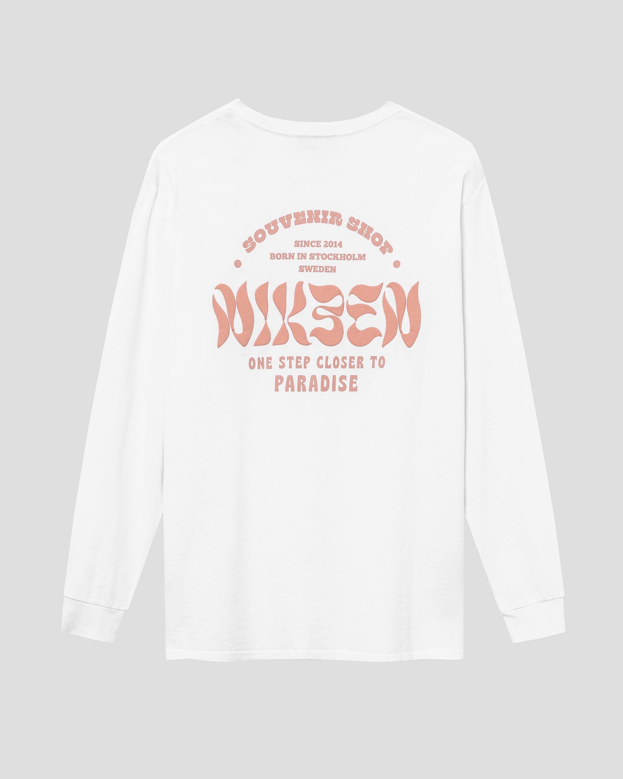 Back view of white long-sleeved t-shirt with large orange text print on the back.